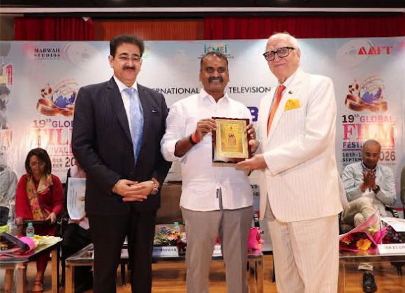 Cdr. K. L. Ganju Presented with Festival Memento by Dr. L. Murugan at 19th Global Film Festival Noida 814585087_1630372868614295_7847284703033350553_n